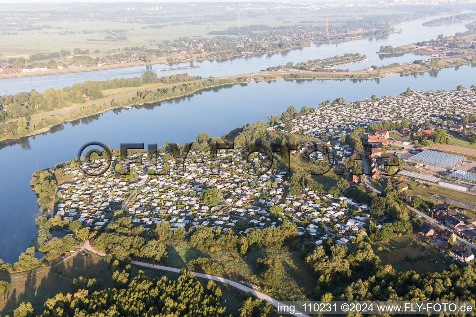 Aerial view of Camping with caravans and tents on the Elbe dyke in the district Ochsenwerder in Hamburg, Germany