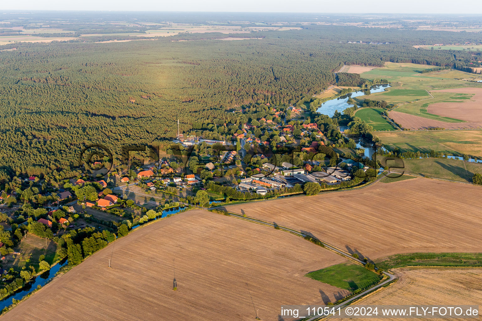 Village - view on the edge of agricultural fields and farmland in Zeetze in the state Lower Saxony, Germany