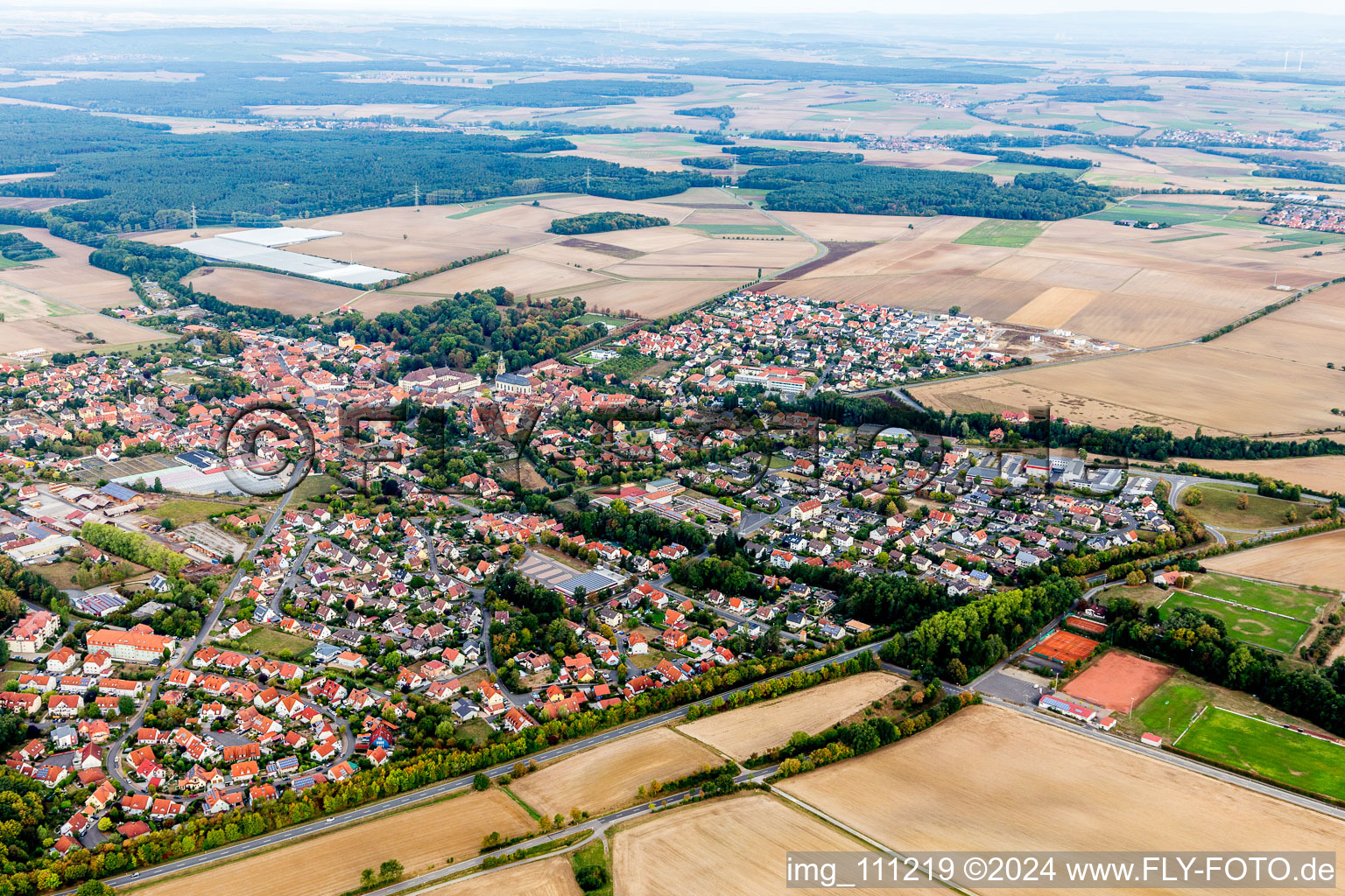 Village view on the edge of agricultural fields and land in Wiesentheid in the state Bavaria, Germany