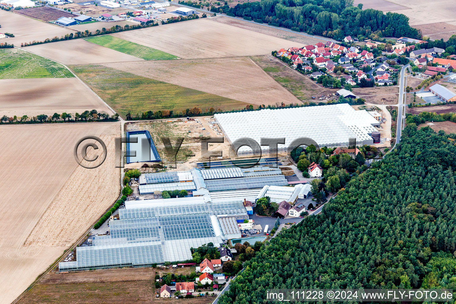 Glass roof surfaces in the greenhouse rows for Floriculture in Schwarzach am Main in the state Bavaria, Germany