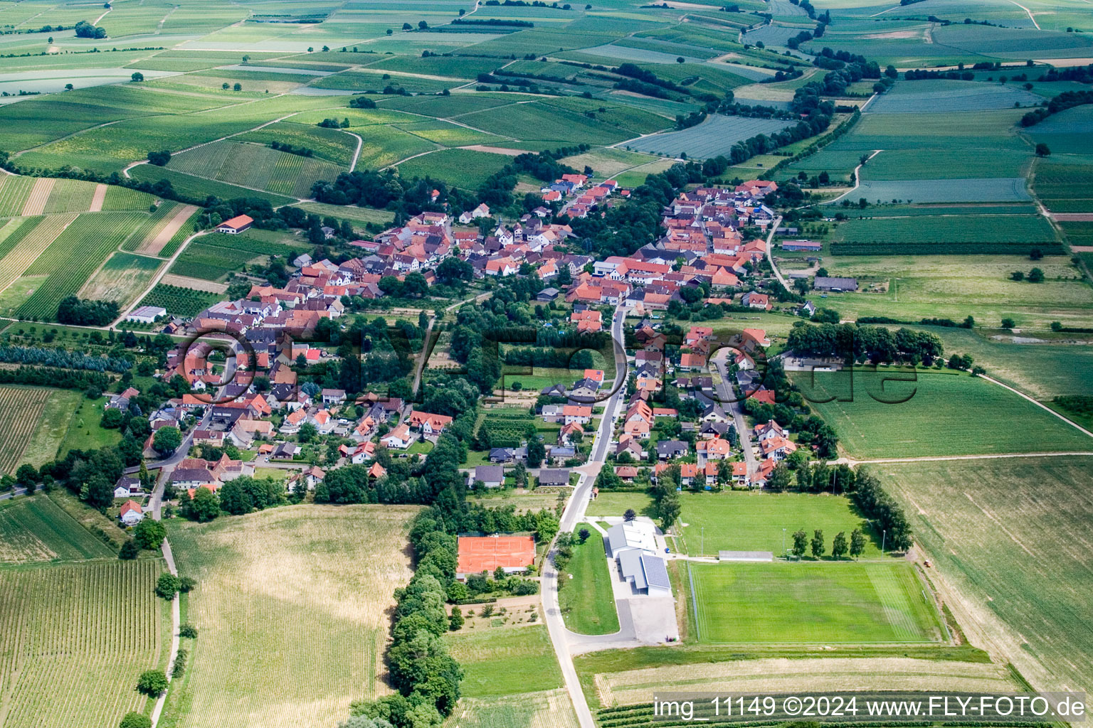 Aerial view of Village - view on the edge of agricultural fields and farmland in Dierbach in the state Rhineland-Palatinate