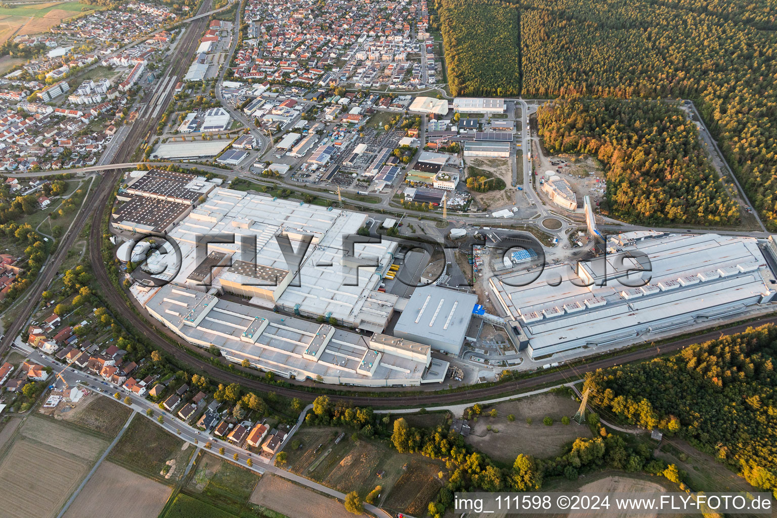 Extension - new building - construction site on the factory premises of SEW-EURODRIVE GmbH & Co KG in Graben-Neudorf in the state Baden-Wurttemberg, Germany seen from a drone