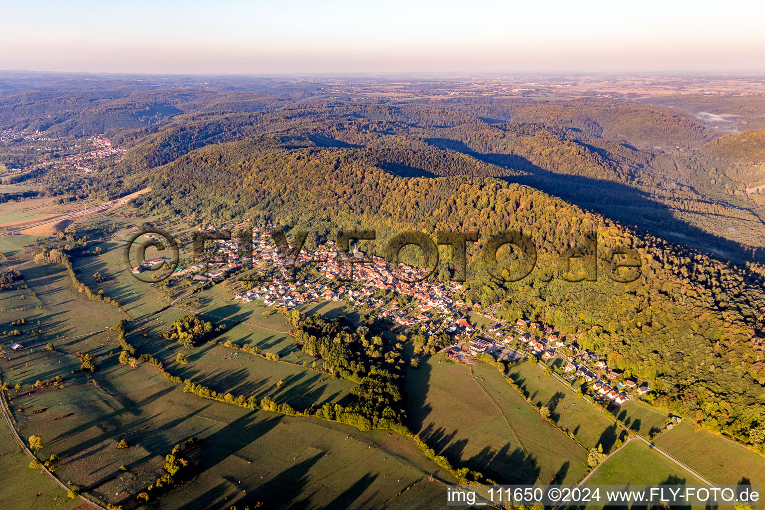 Aerial view of Village - view on the edge of agricultural fields and farmland in Ernolsheim-les-Saverne in Grand Est, France