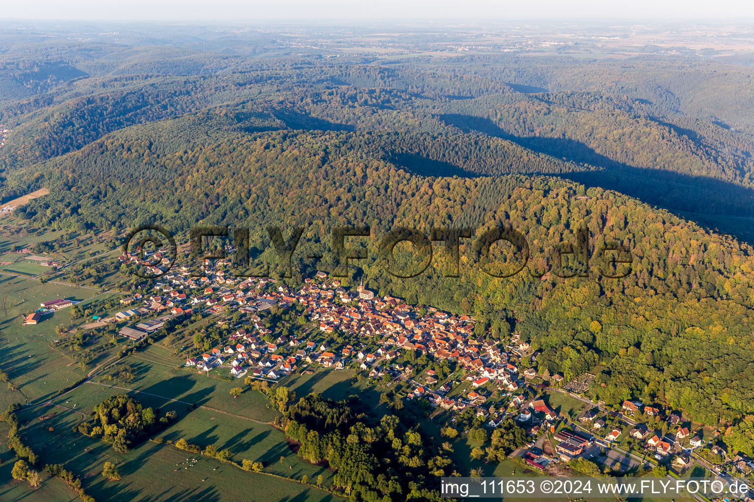 Aerial photograpy of Village - view on the edge of agricultural fields and farmland in Ernolsheim-les-Saverne in Grand Est, France