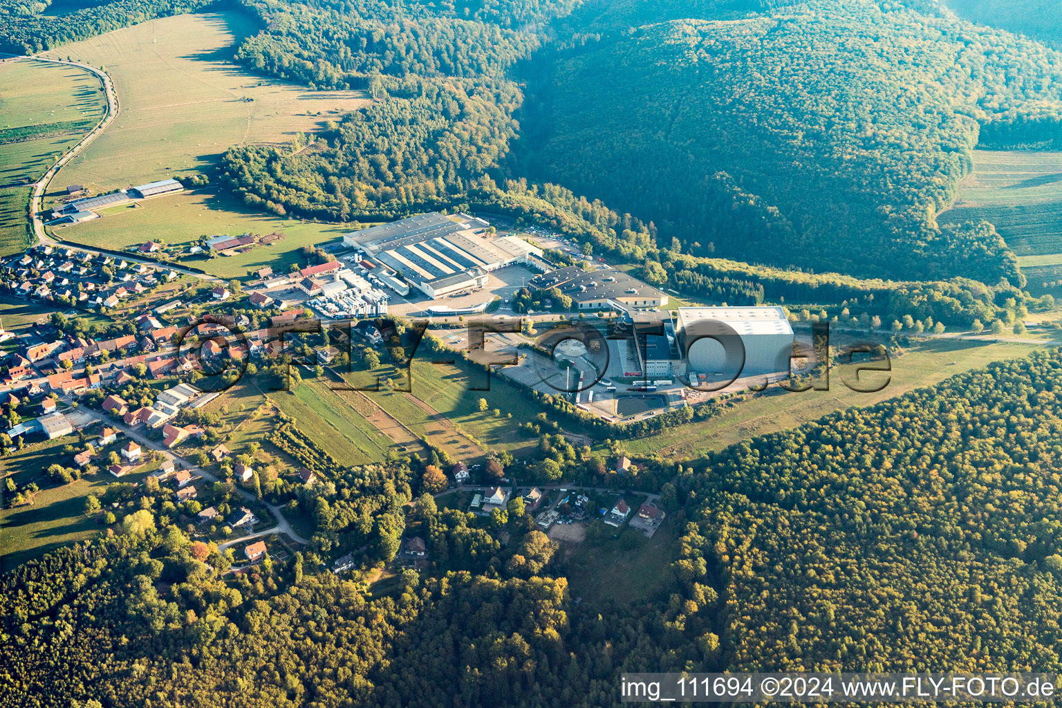 Aerial view of Industrial estate and company settlement with Grands Chais de France and Wineshop Ice par Blanc Foussy in Petersbach in Grand Est, France