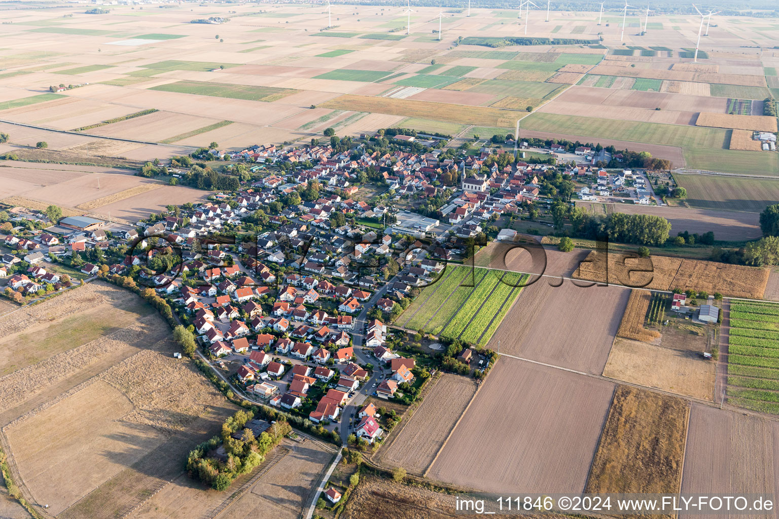 Village view on the edge of agricultural fields and land in Knittelsheim in the state Rhineland-Palatinate, Germany