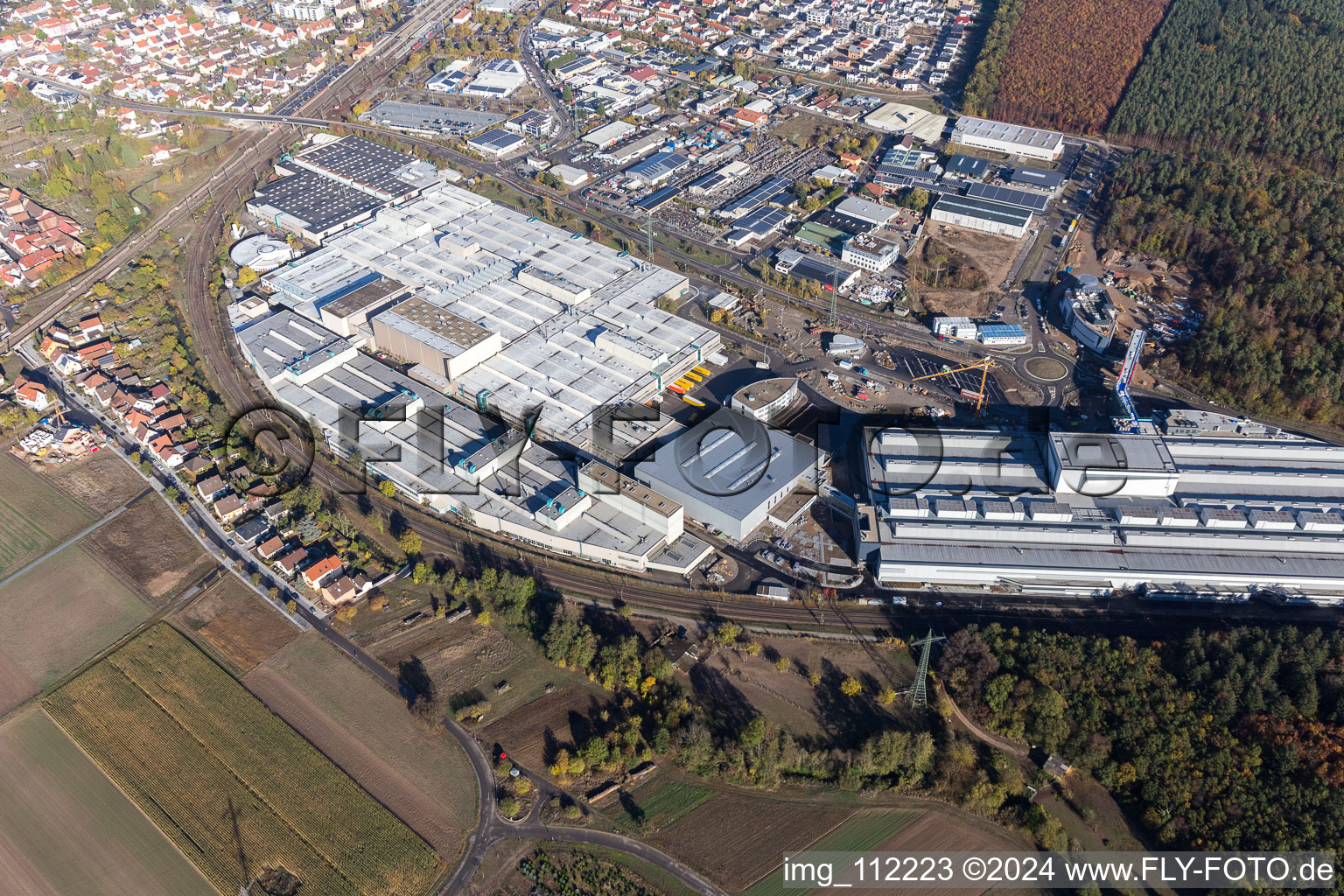 Oblique view of Extension - new building - construction site on the factory premises of SEW-EURODRIVE GmbH & Co KG in Graben-Neudorf in the state Baden-Wurttemberg, Germany