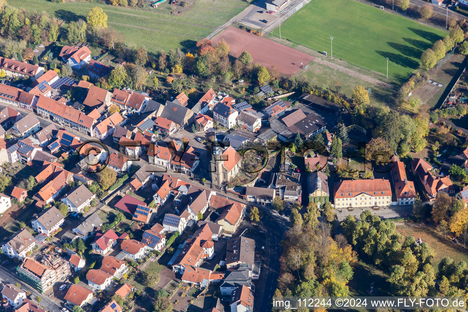 Church and sports field in the district Eichtersheim in Angelbachtal in the state Baden-Wuerttemberg, Germany