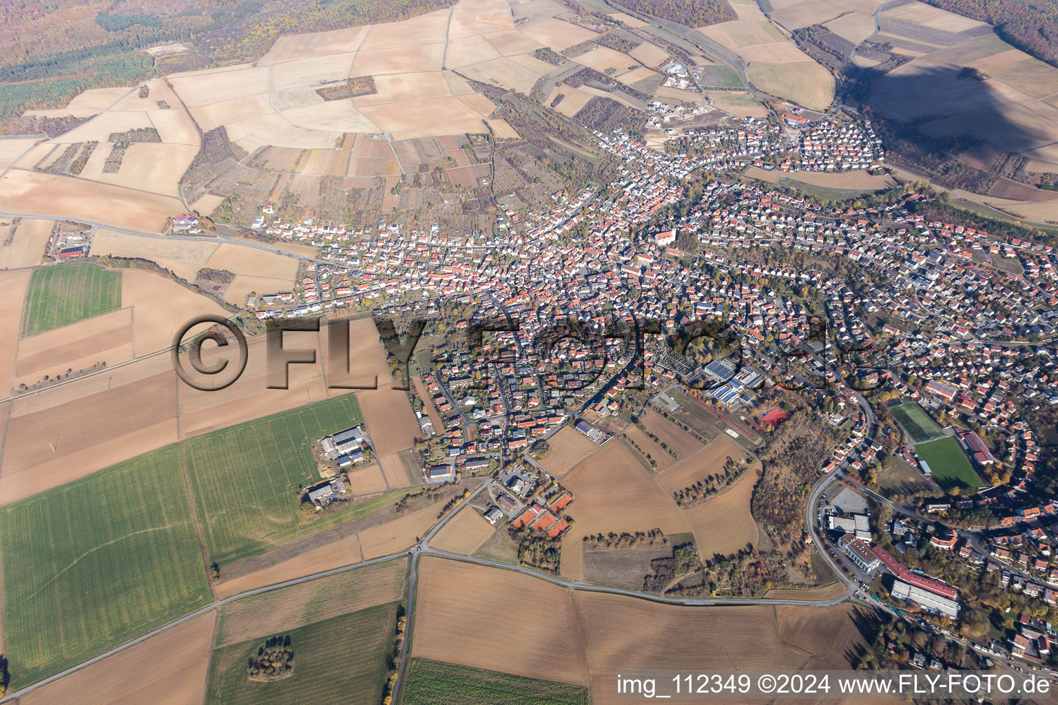 Village view on the edge of agricultural fields and land in Rimpar in the state Bavaria, Germany