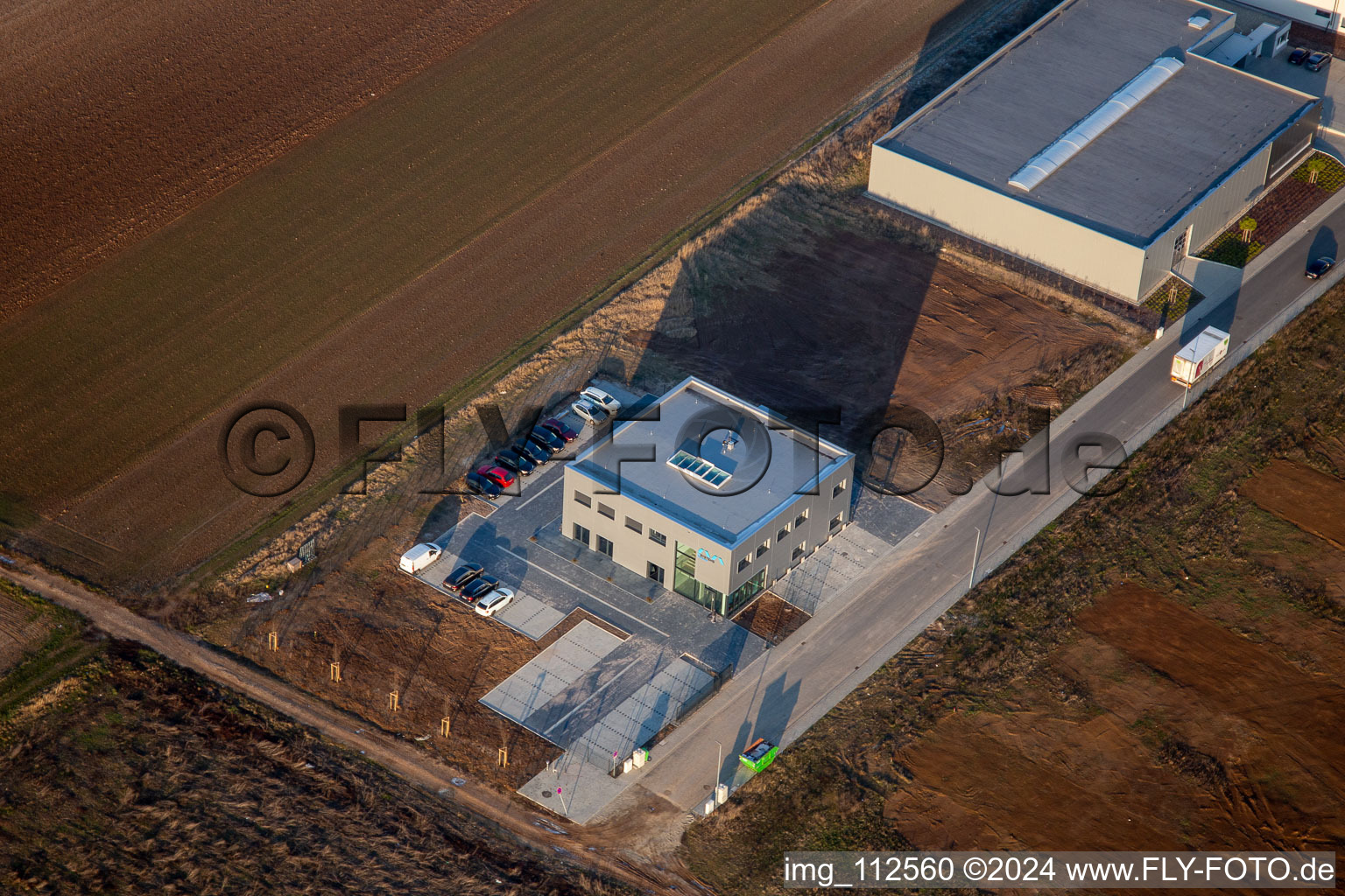 Aerial view of New building construction site in the industrial park Gewerbepark West with M-Systems IT Solutions in Herxheim bei Landau (Pfalz) in the state Rhineland-Palatinate, Germany