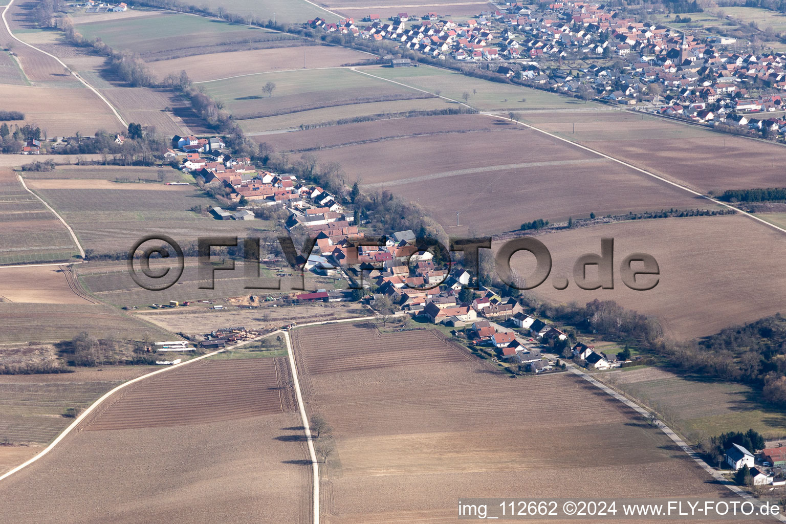 Aerial view of Village - view on the edge of agricultural fields and farmland in Vollmersweiler in the state Rhineland-Palatinate, Germany