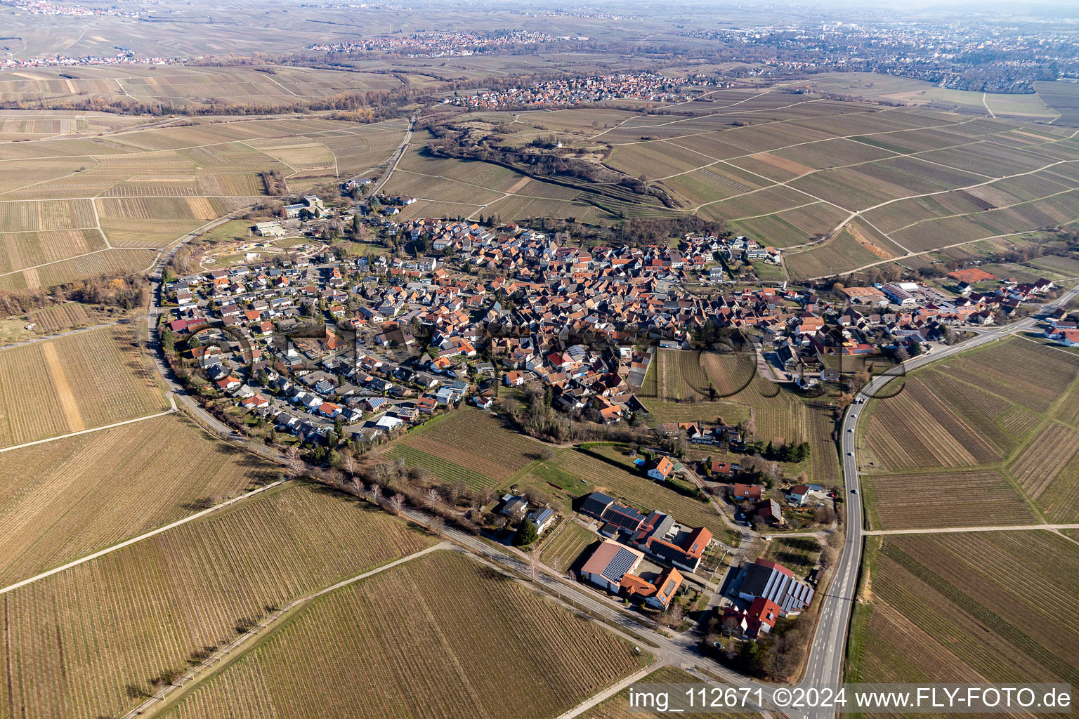 Agricultural land and field borders surround the settlement area of the village in Ilbesheim bei Landau in der Pfalz in the state Rhineland-Palatinate, Germany