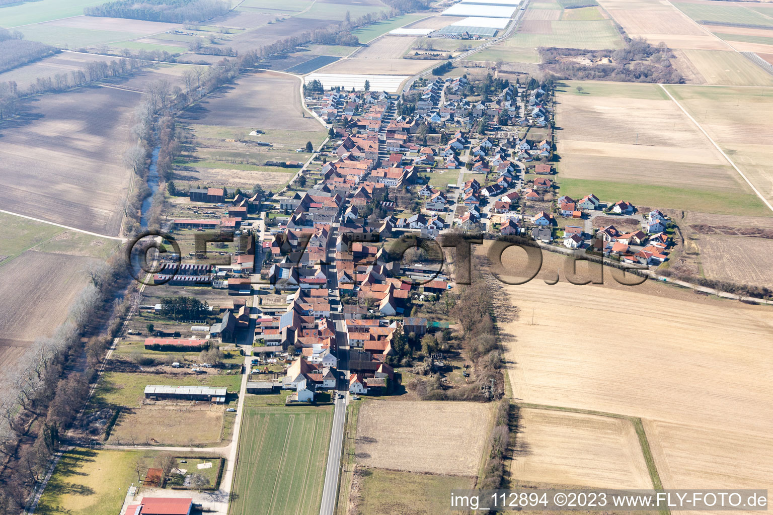 Aerial view of Village - view on the edge of agricultural fields and farmland in Herxheimweyher in the state Rhineland-Palatinate, Germany