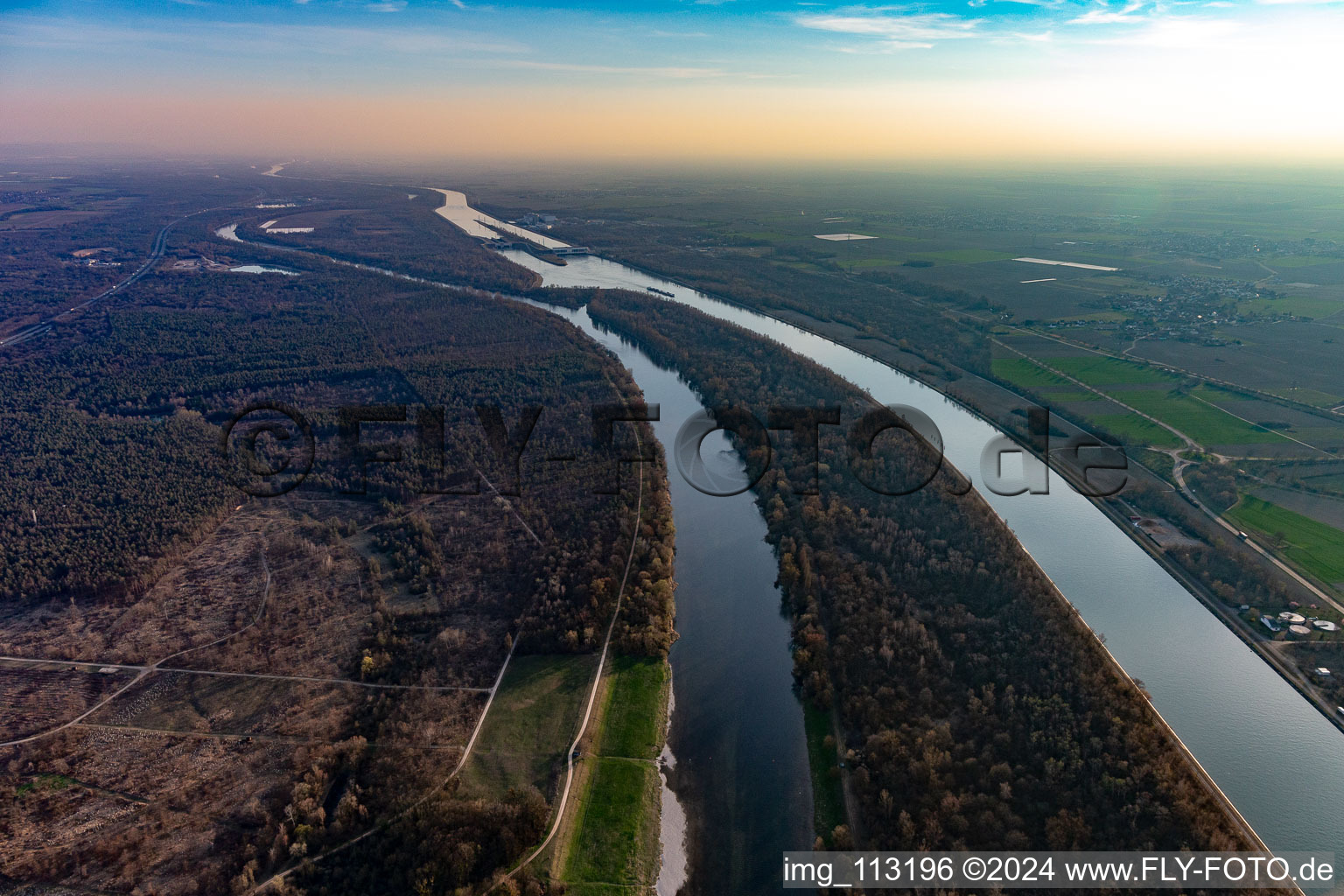 Island on the banks of the river course of Rhein and Rheinkanals in Fessenheim in Grand Est, France