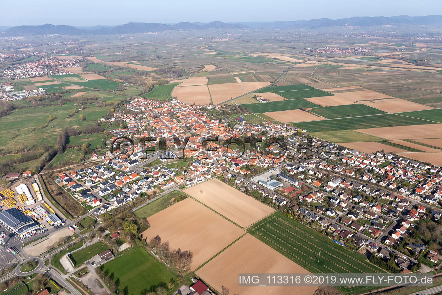 Village - view on the edge of agricultural fields and farmland in Rohrbach in the state Rhineland-Palatinate, Germany from above