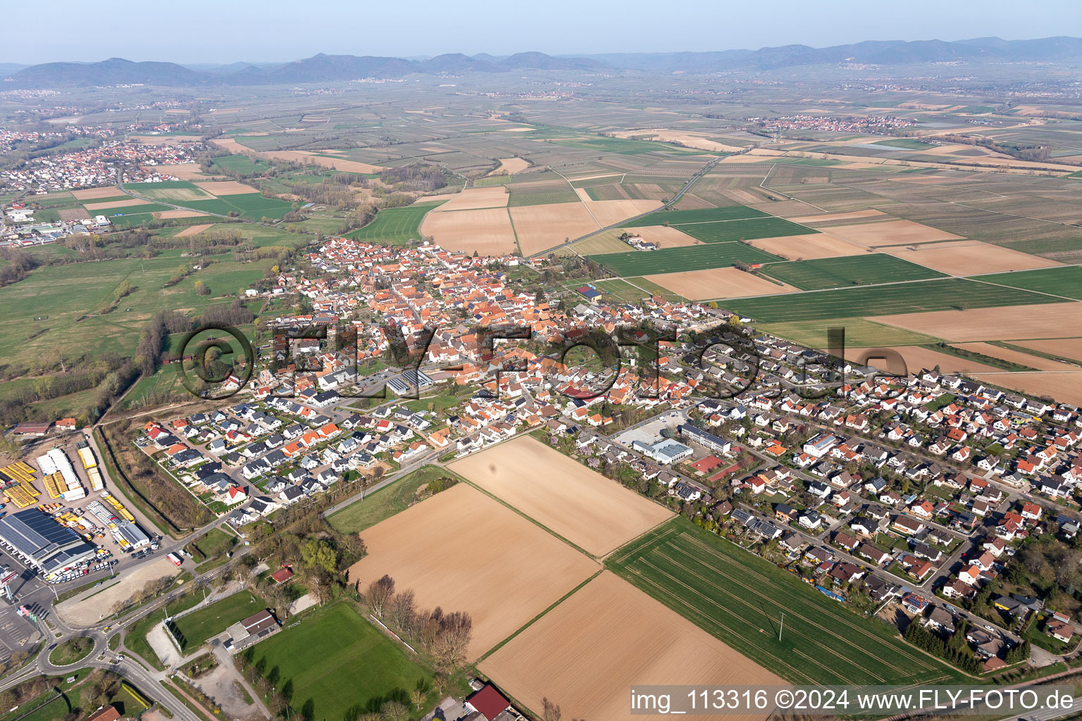 Village - view on the edge of agricultural fields and farmland in Rohrbach in the state Rhineland-Palatinate, Germany from above