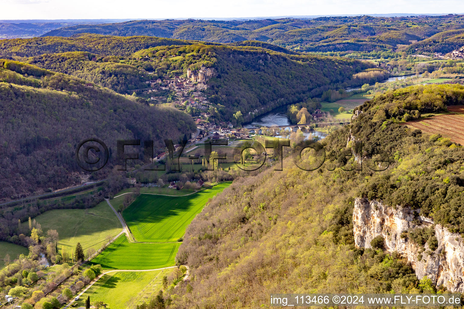 Aerial photograpy of Chateau de Castelnaud-la Chapelle over the Dordogne Bridge in Castelnaud-la-Chapelle in the state Dordogne, France