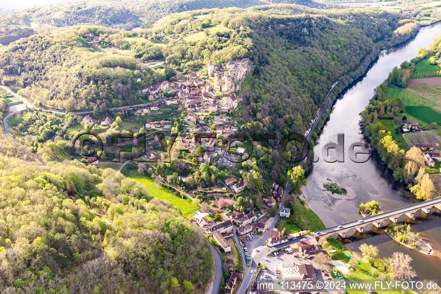 Chateau de Castelnaud-la Chapelle over the Dordogne bridge in Castelnaud-la-Chapelle in the state Dordogne, France out of the air