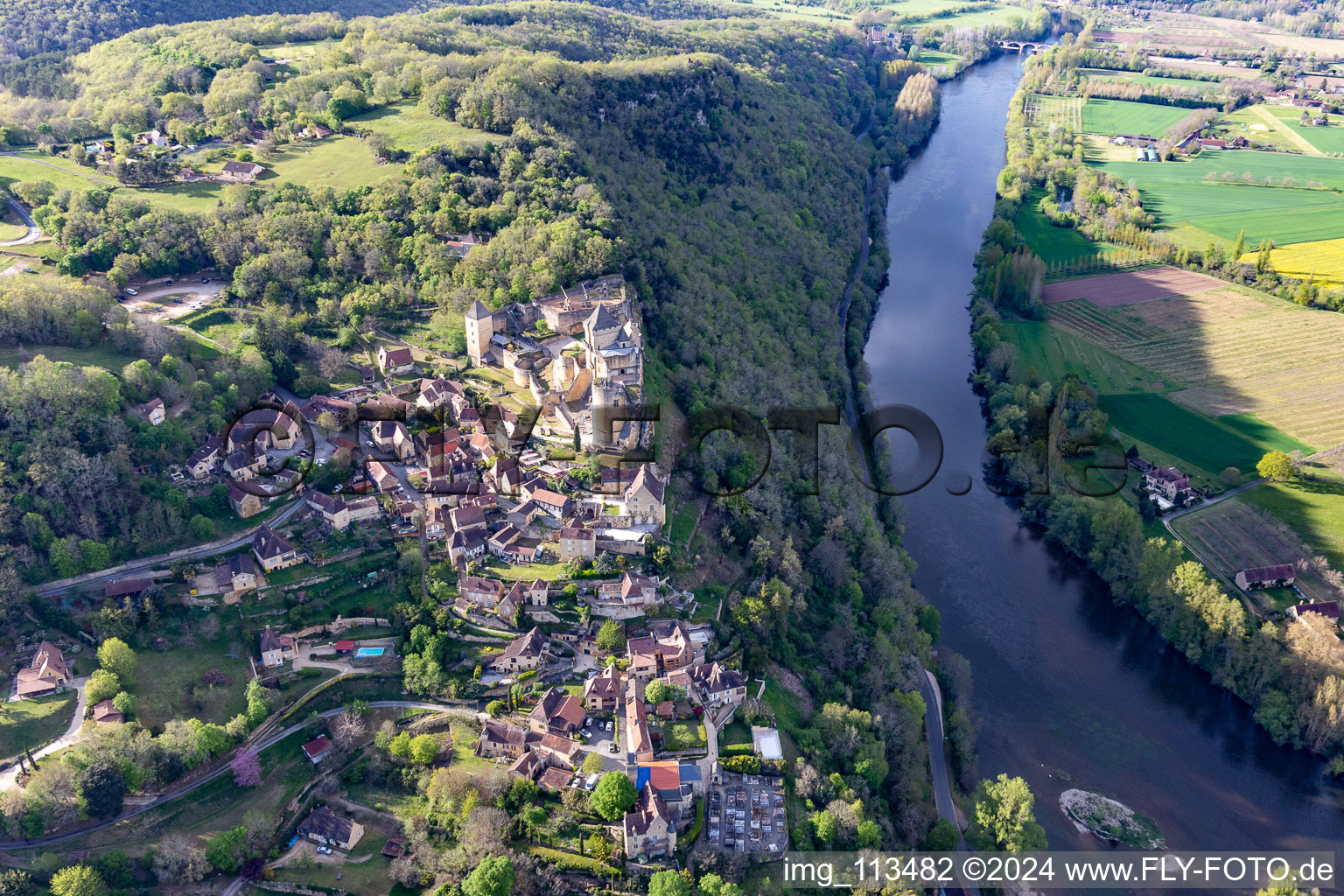 Chateau de Castelnaud-la Chapelle over the Dordogne Bridge in Castelnaud-la-Chapelle in the state Dordogne, France from the plane