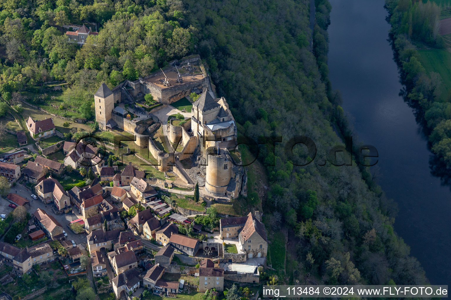 Bird's eye view of Chateau de Castelnaud-la Chapelle over the Dordogne Bridge in Castelnaud-la-Chapelle in the state Dordogne, France