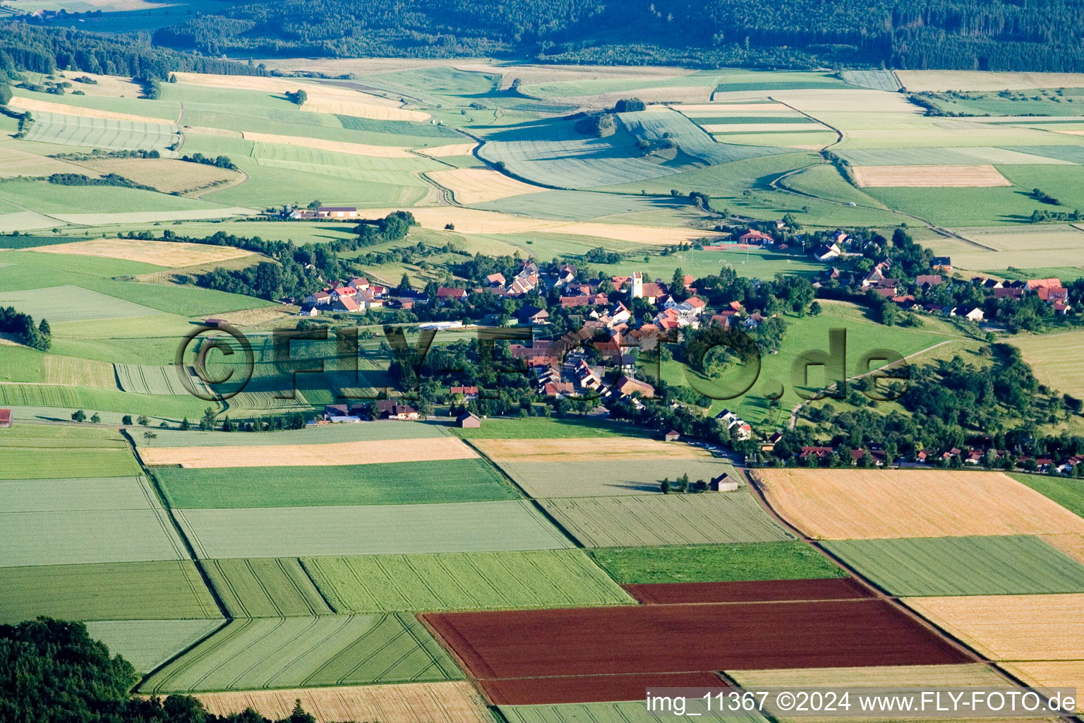 Village - view on the edge of agricultural fields and farmland in Gunningen in the state Baden-Wurttemberg, Germany