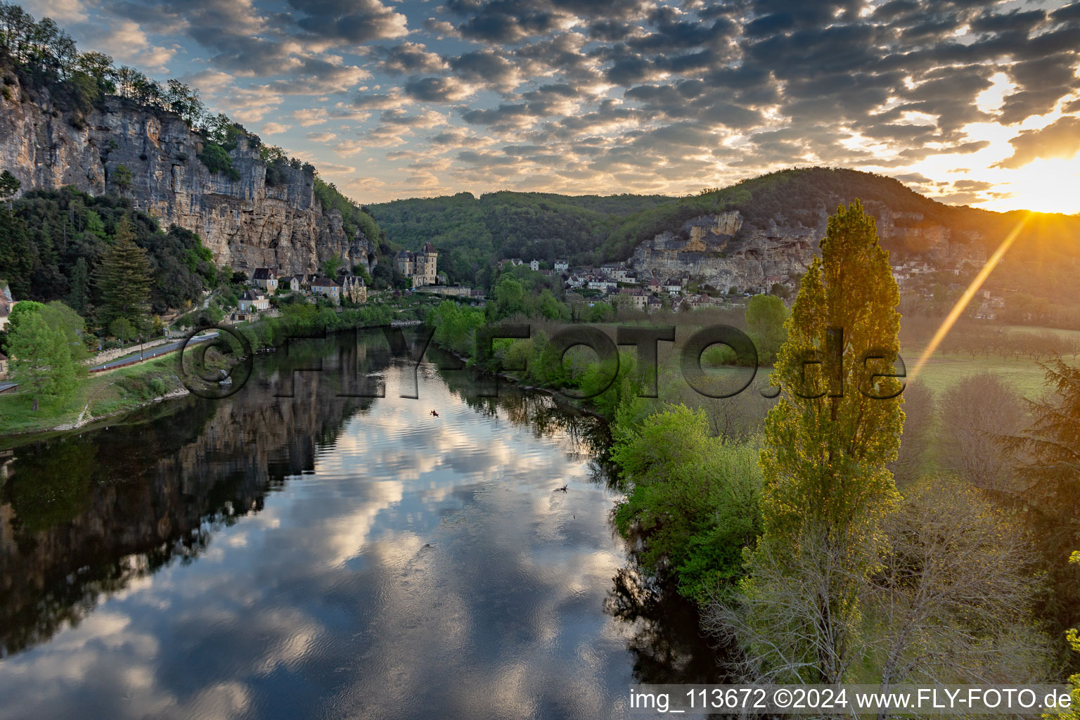 Chateau de la Malartrie over the Dordogne at sunrise from the balloon in La Roque-Gageac in the state Dordogne, France