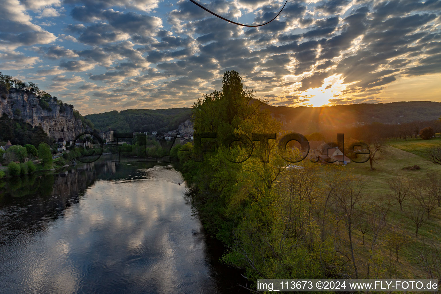 Chateau de la Malartrie at sunrise over the Dordogne in La Roque-Gageac in the state Dordogne, France