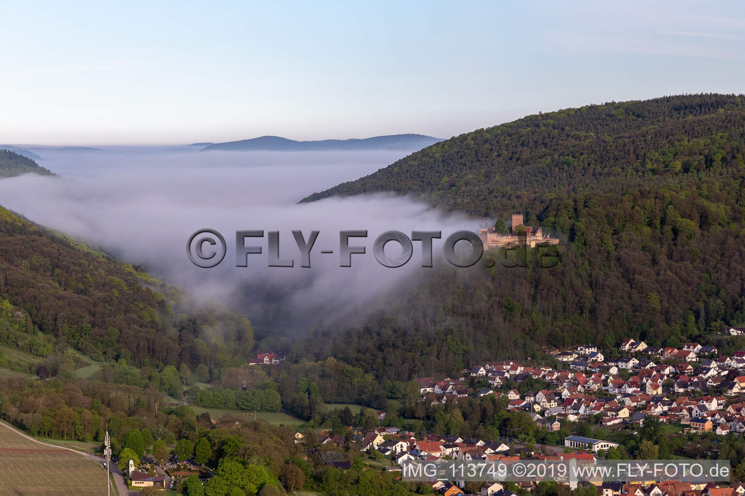 Aerial photograpy of Landeck Castle in the morning fog in Klingenmünster in the state Rhineland-Palatinate, Germany
