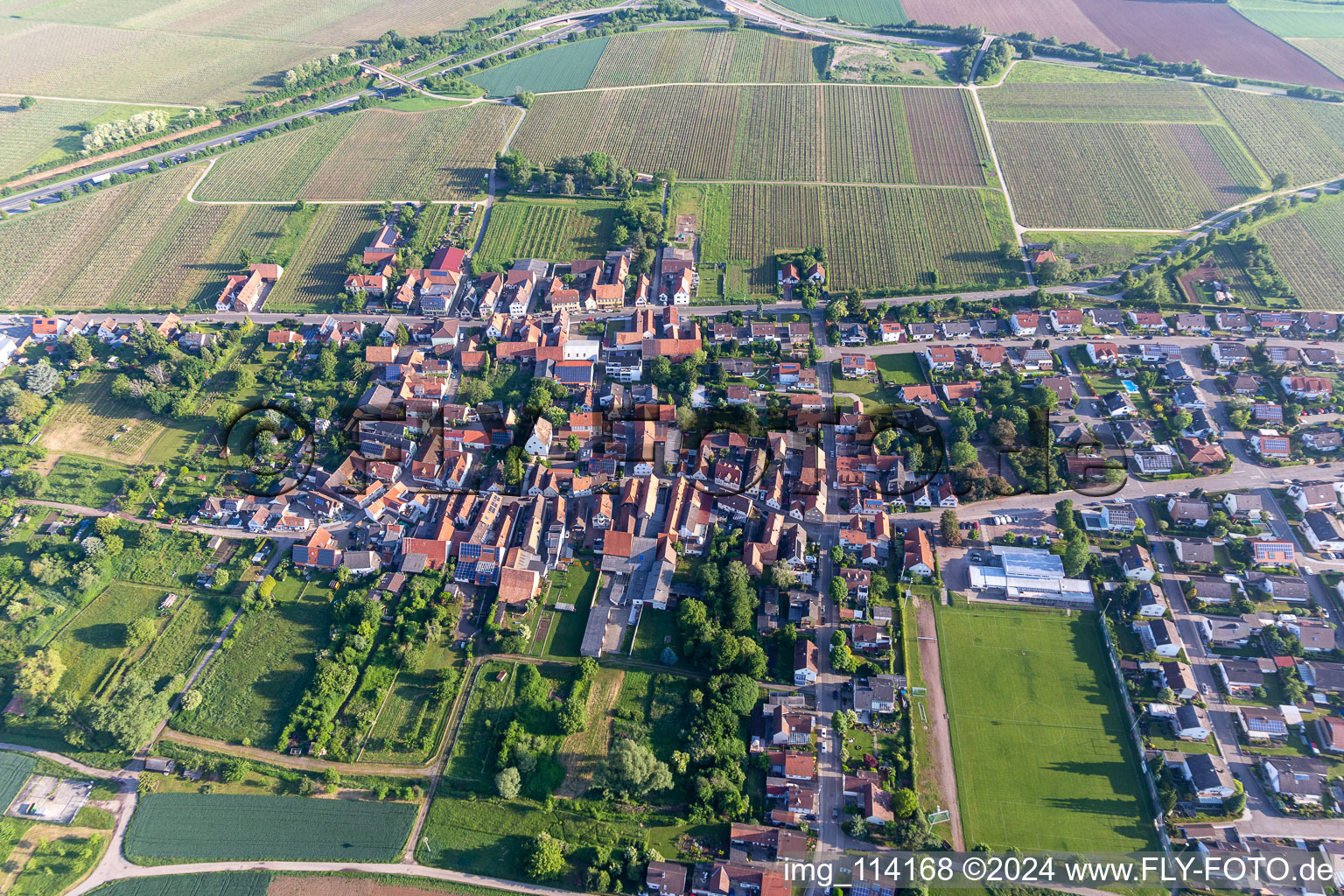 Bird's eye view of Agricultural land and field borders surround the settlement area of the village in Dammheim in the state Rhineland-Palatinate, Germany