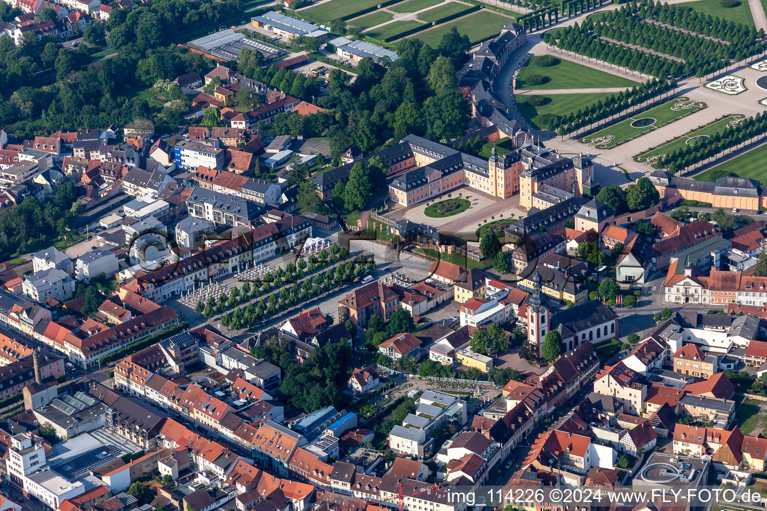 Ensemble space of Schlossplatz with Strassencaffes and Alleebaeumen in the inner city center in Schwetzingen in the state Baden-Wurttemberg, Germany