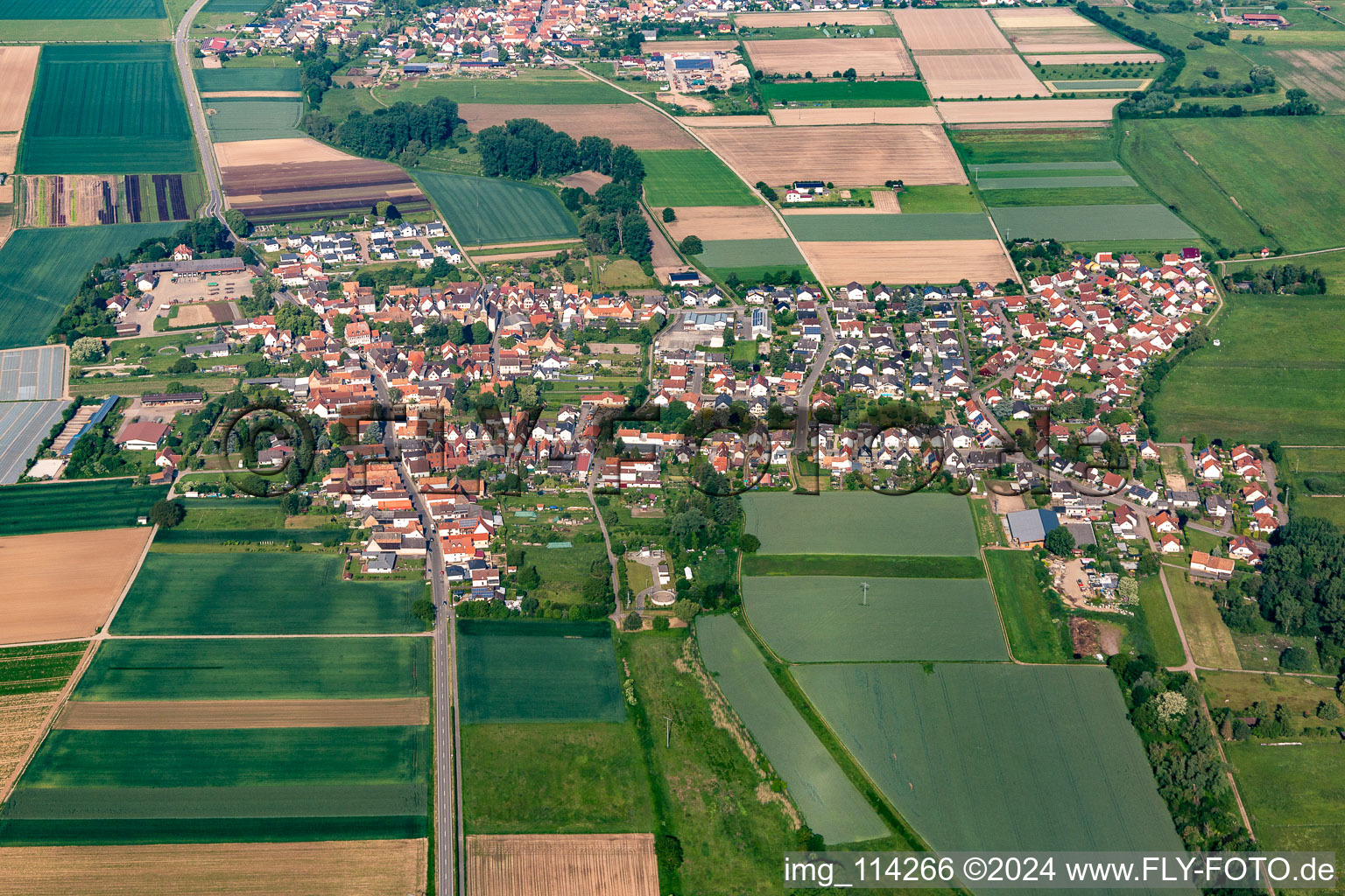 Aerial view of Village view on the edge of agricultural fields and land in Knittelsheim in the state Rhineland-Palatinate, Germany