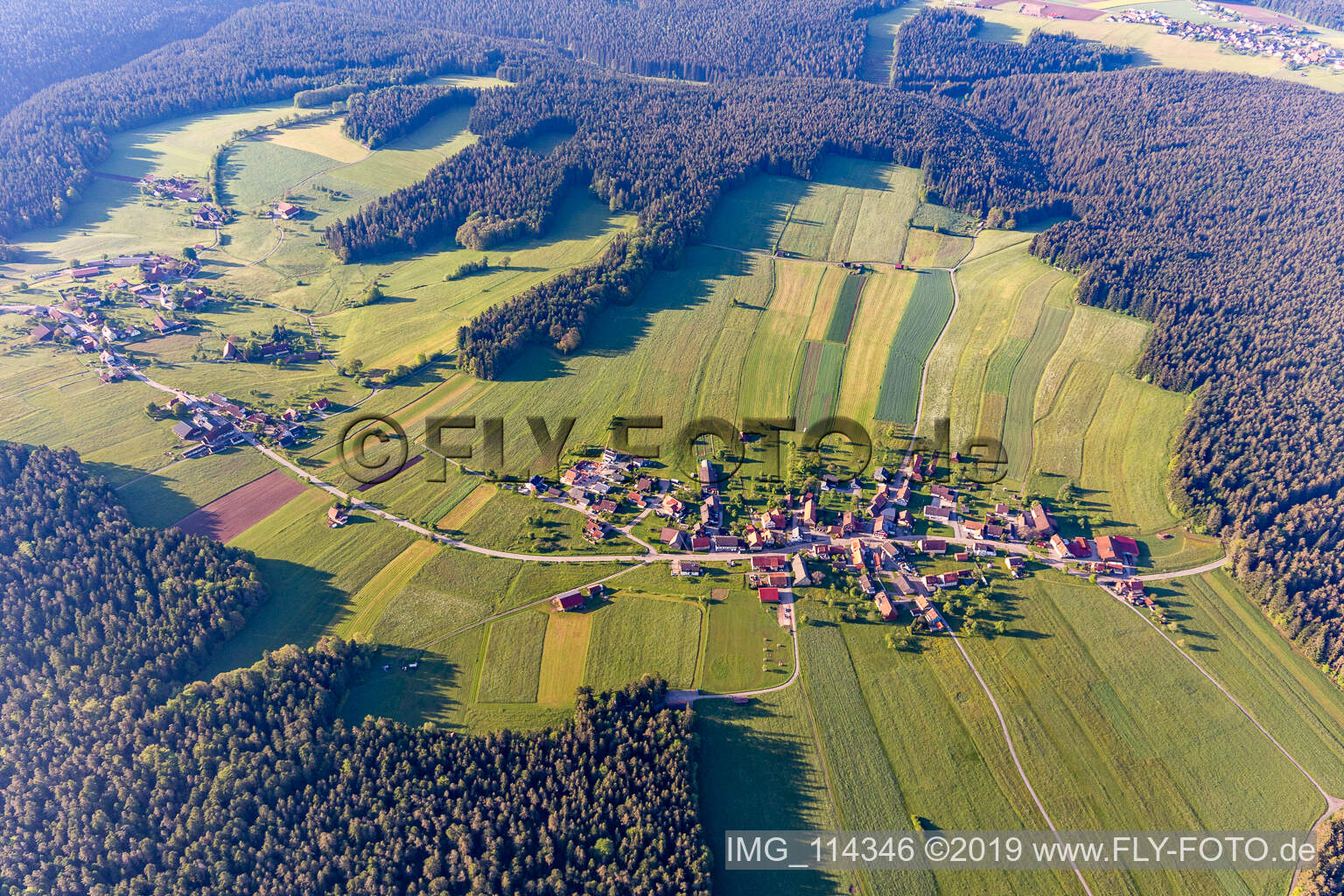 Aerial view of Surrounded by forest and forest areas center of the streets and houses and residential areas in Aichelberg in the state Baden-Wurttemberg, Germany