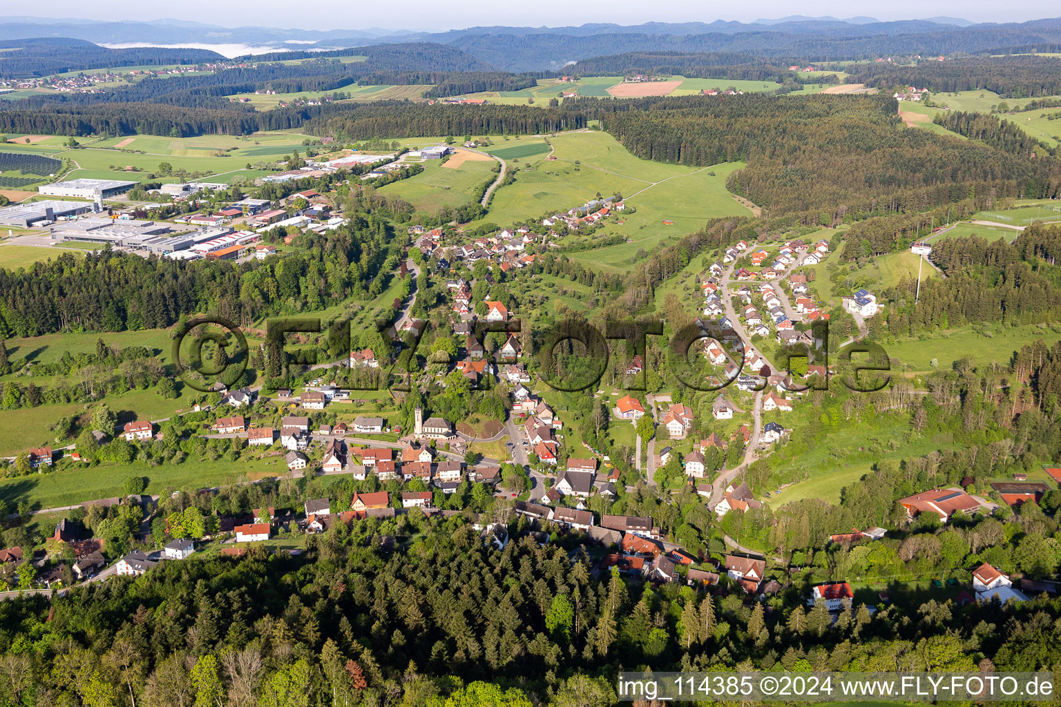 Location view of the streets and houses of residential areas in the valley landscape surrounded by mountains in Betzweiler in the state Baden-Wurttemberg, Germany