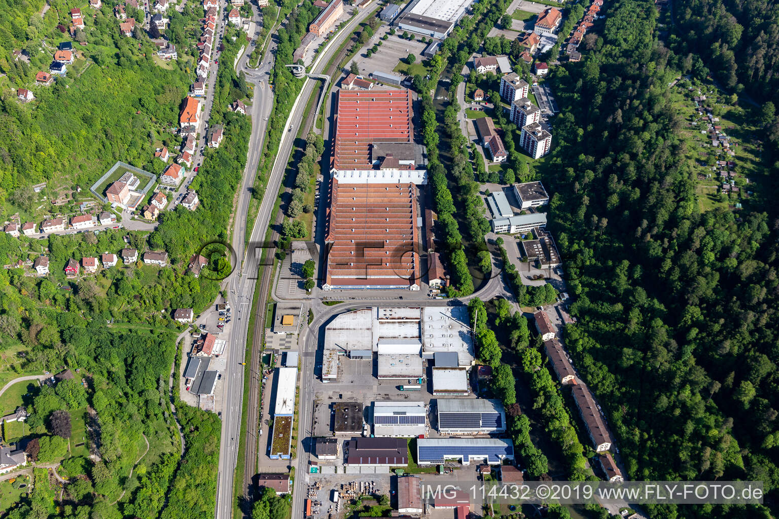 Aerial view of Building and production halls on the premises of Mauser-Werke Oberndorf Maschinenbau GmbH in Oberndorf am Neckar in the state Baden-Wurttemberg, Germany
