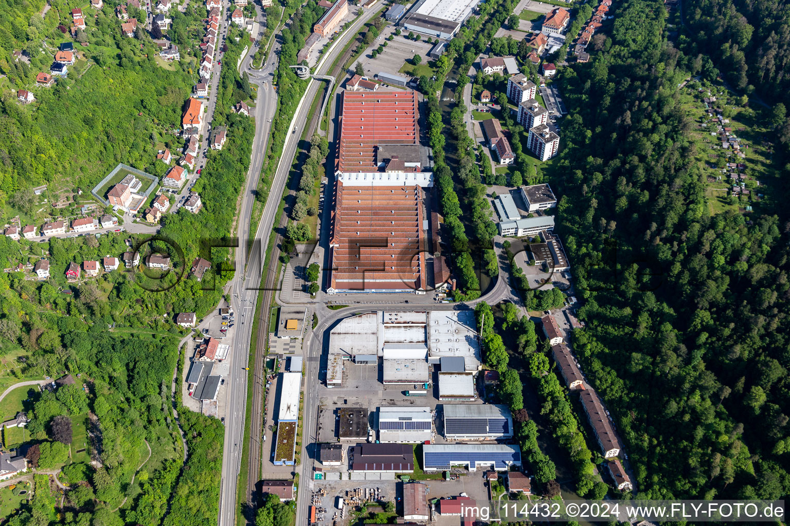 Aerial view of Building and production halls on the premises of Mauser-Werke Oberndorf Maschinenbau GmbH in Oberndorf am Neckar in the state Baden-Wurttemberg, Germany