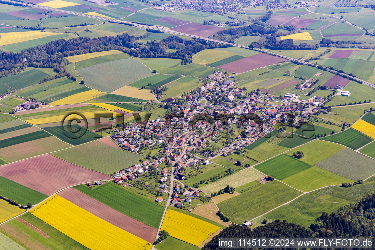 Aerial photograpy of Agricultural land and field borders surround the settlement area of the village in Irslingen in the state Baden-Wurttemberg, Germany