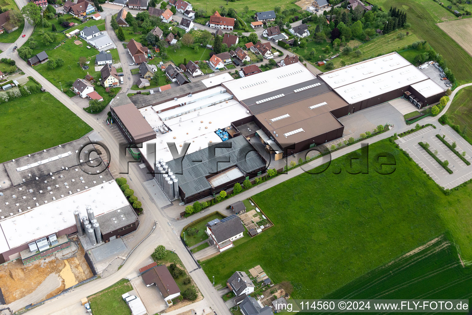 Aerial view of Building and production halls on the premises of Saier Verpackungstechnik in Alpirsbach in the state Baden-Wurttemberg, Germany