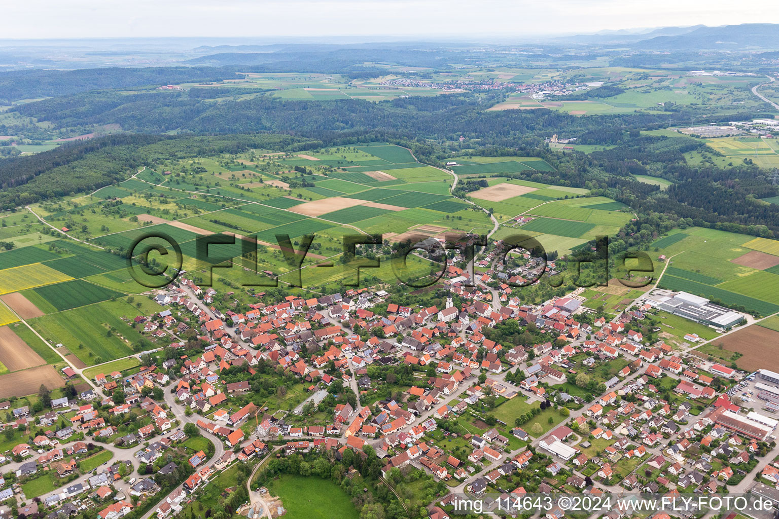 Agricultural land and field borders surround the settlement area of the village in Ostdorf in the state Baden-Wurttemberg, Germany