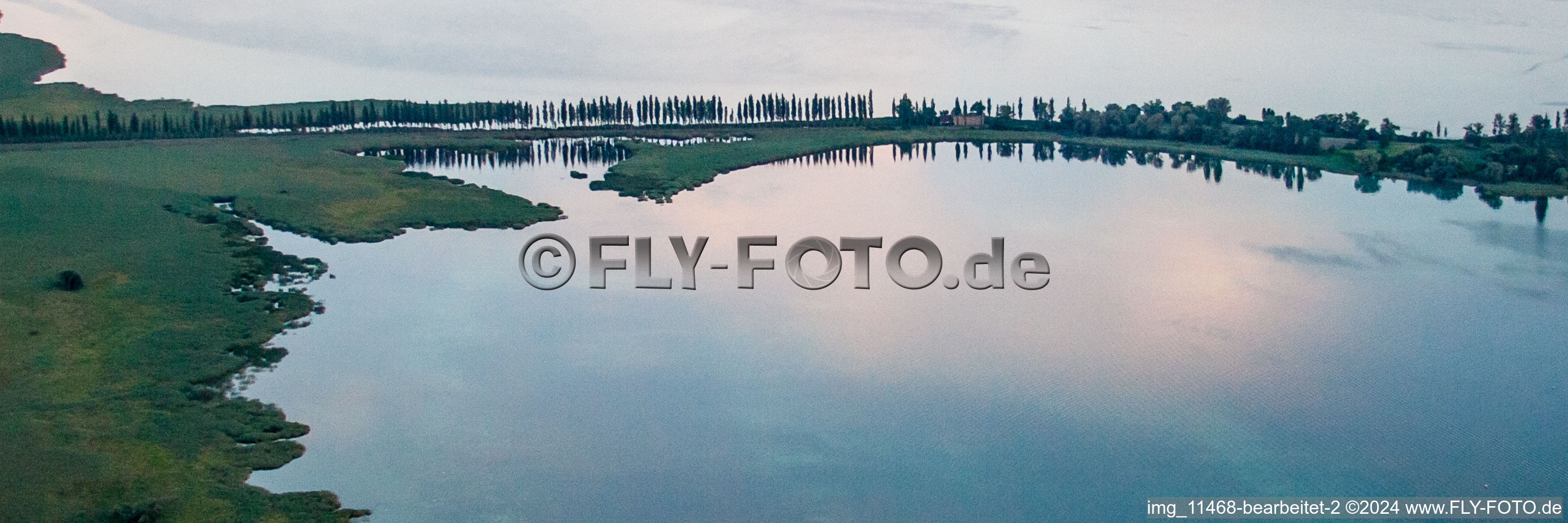 Bridge to the Island Reichenau on the Lake of Constance during sunset in Reichenau in the state Baden-Wurttemberg