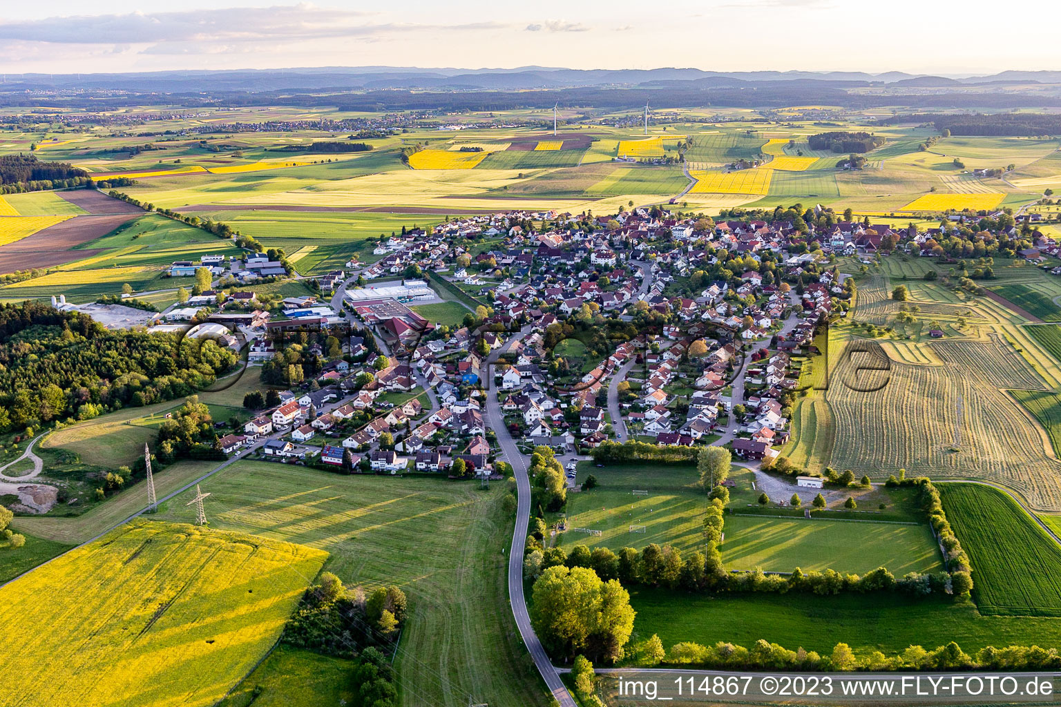 Agricultural land and field borders surround the settlement area of the village in Hochmoessingen in the state Baden-Wurttemberg, Germany