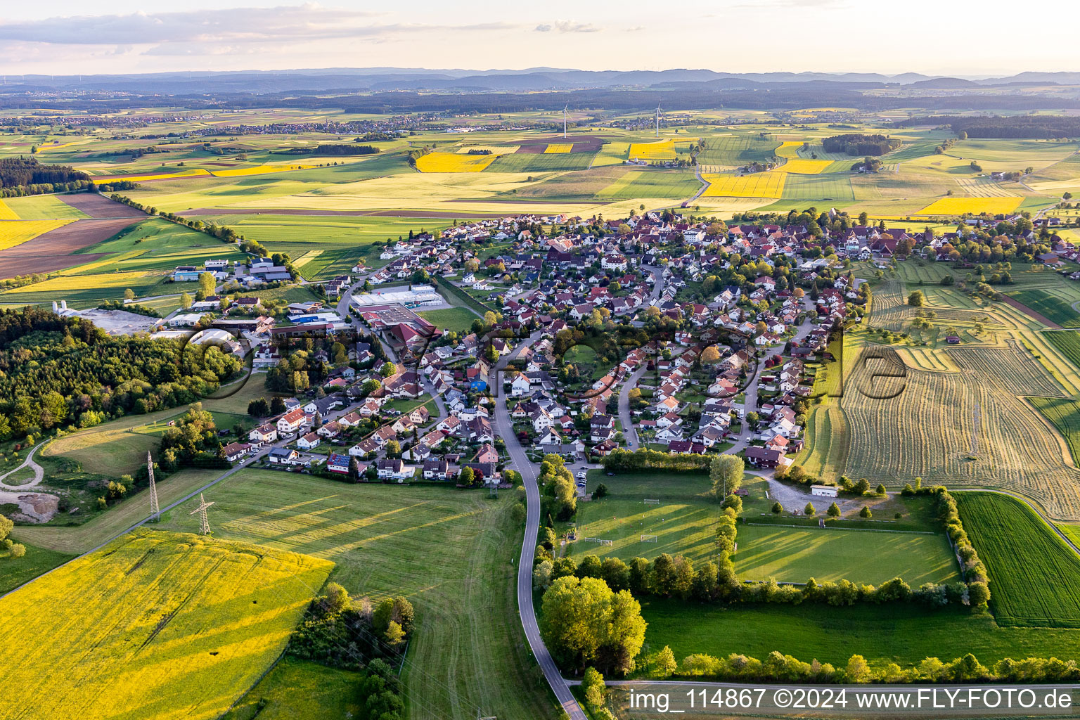 Agricultural land and field borders surround the settlement area of the village in Hochmoessingen in the state Baden-Wurttemberg, Germany