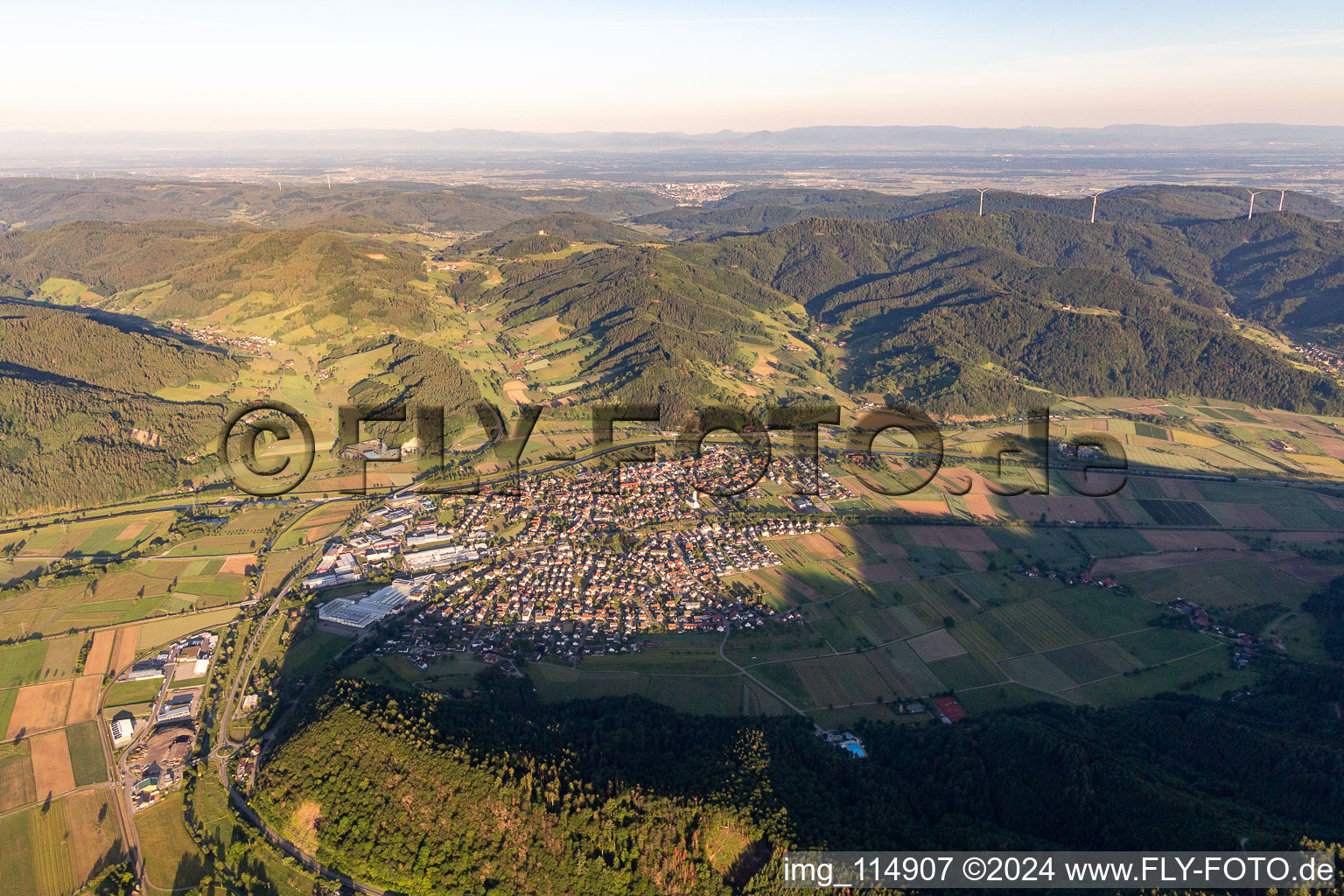 Location view of the streets and houses of residential areas in the valley landscape surrounded by mountains of the Black Forest in Biberach in the state Baden-Wurttemberg, Germany