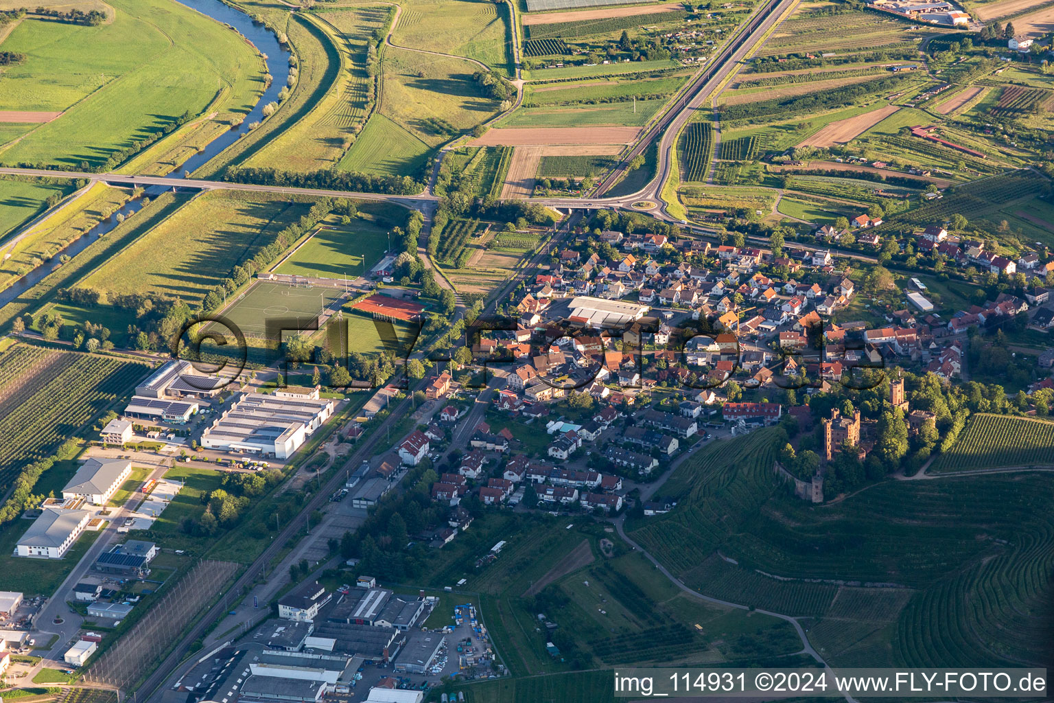 Location view of the streets and houses of residential areas in the valley landscape surrounded by mountains in Ortenberg in the state Baden-Wurttemberg, Germany