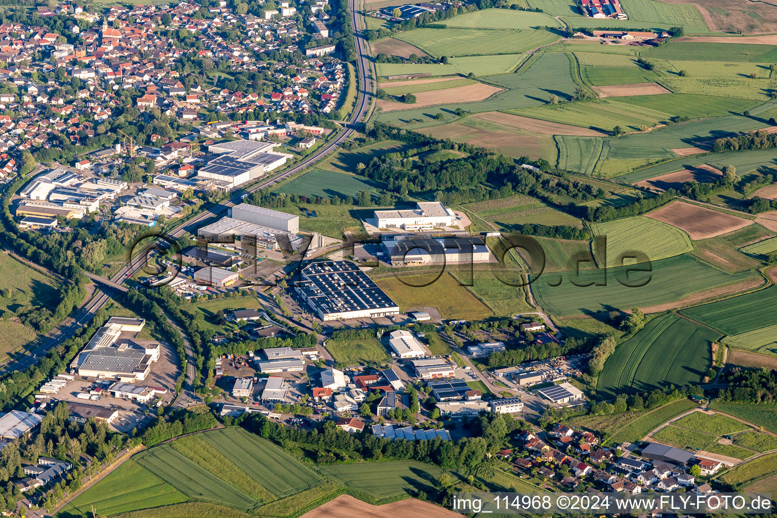 Industrial and commercial area Im Lossenfeld with Lackmann Fleisch- and Feinkostfabrik GmbH, Philipp Kirsch GmbH, W. Armbruster Teigwarenfabrik GmbH, TBV Kuehlfahrzeuge GmbH and ORSAY GmbH in Willstaett in the state Baden-Wurttemberg, Germany