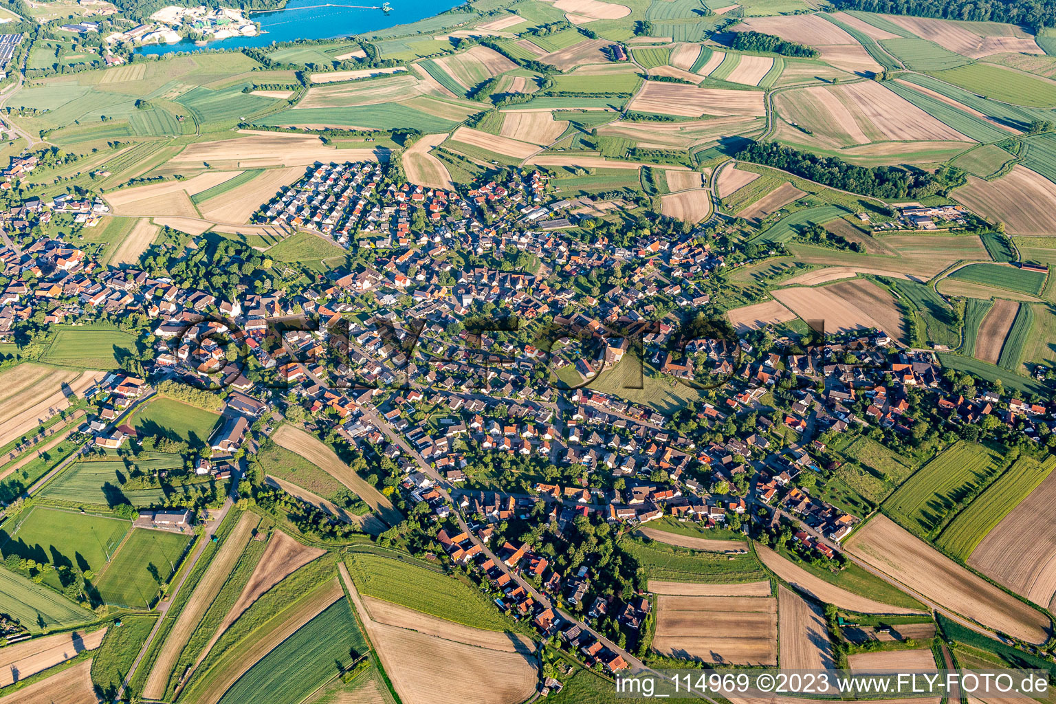 Agricultural land and field borders surround the settlement area of the village in Legelshurst in the state Baden-Wurttemberg, Germany
