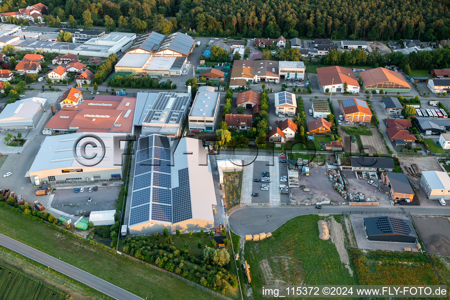 Oblique view of Industrial estate and company settlement Im Gereut with WWS Metallformen GmbH and HGGS LaserCUT GmbH & Co. KG in Hatzenbuehl in the state Rhineland-Palatinate