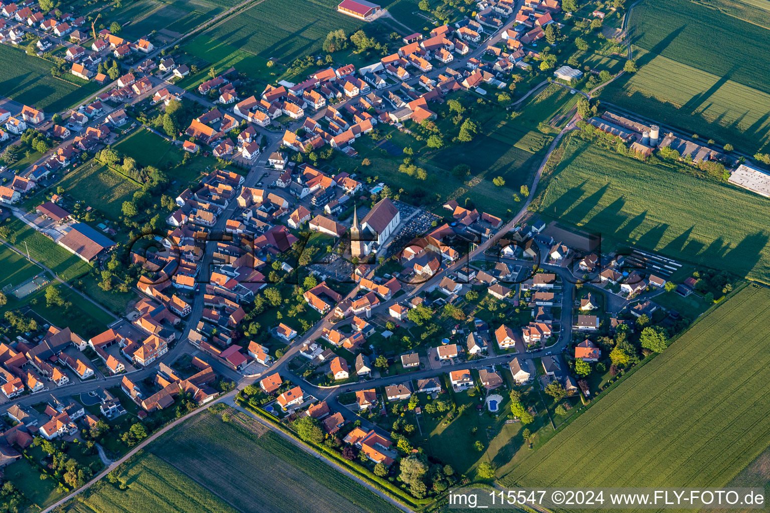 Aerial view of Church building in the village of in Schleithal in Grand Est, France