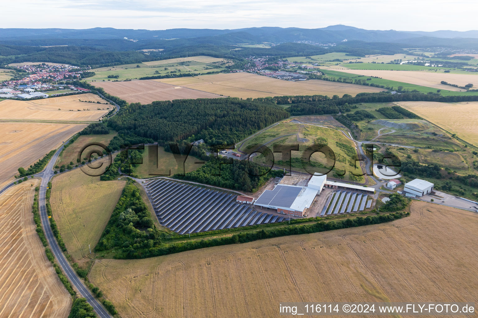 Panel rows of photovoltaic and solar farm or solar power plant on an old landfill of Kommunaler Abfallservice of Landkreises Gotha in Leinatal in the state Thuringia, Germany