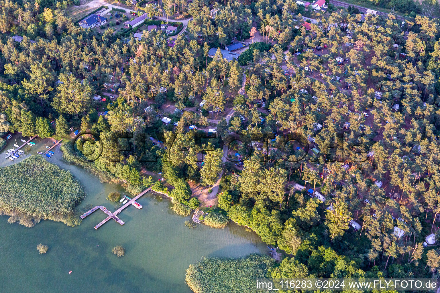 Canoo berths and moorings on the shore area of Conping on Oberuckersee in the district Warnitz in Oberuckersee in the state Brandenburg, Germany