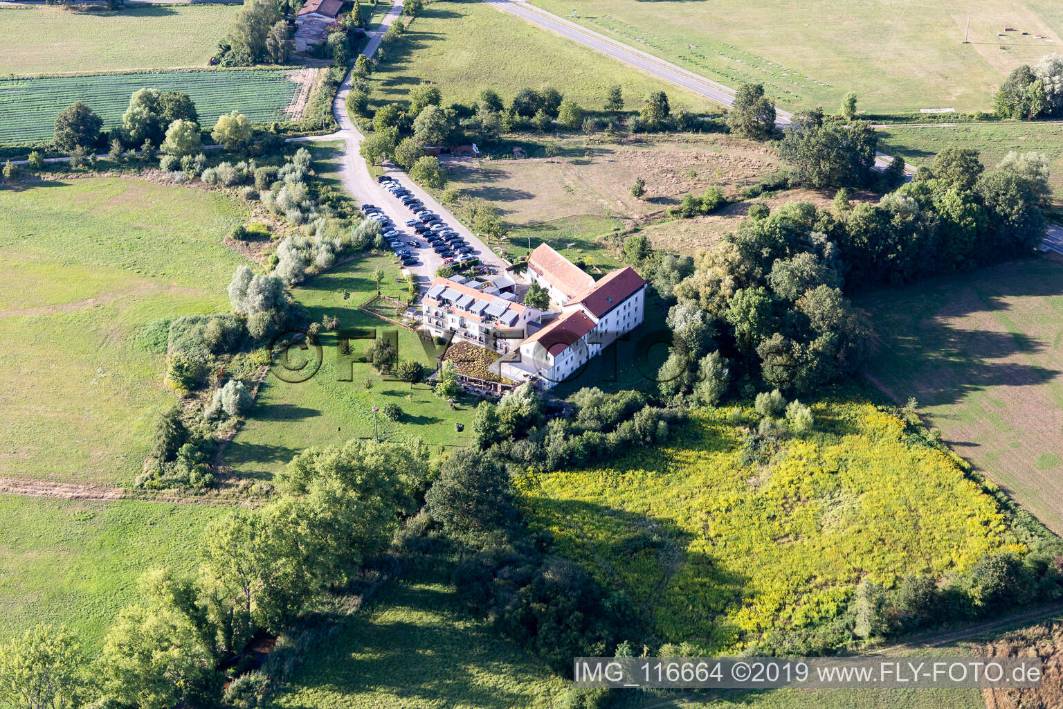 Aerial view of Complex of the hotel building Zeiskamer Muehle in Zeiskam in the state Rhineland-Palatinate, Germany